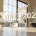 START 2026 Text with Paper Airplanes in Modern Office Concept